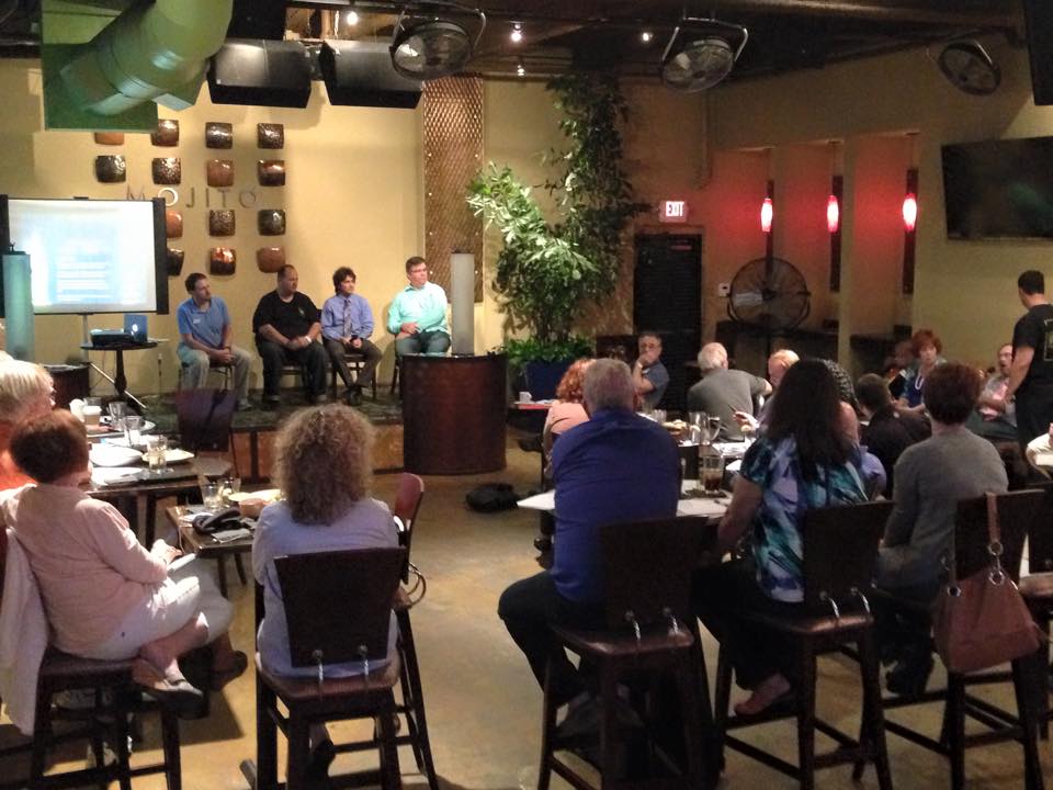 Photo of Stuart Mackey, Founder and Creative Director at Mackey Productions, answers questions regarding podcast production during a panel at the monthly Florida Podcaster's Association, in Tampa, FL.