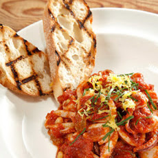 Sauteed Calamari with Tomatoes, Basil, Raisins, and Pine Nuts