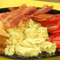 Herb and Egg Scramble with Garlic Toast and Sliced Tomato