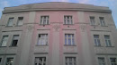 Pink Building with Faces