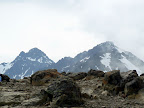 the Ptarmigan peaks appear over the summit of Flattop