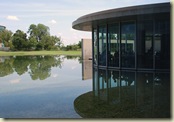 The cafe is integrated into a reflecting pond