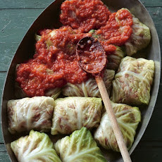 Stuffed Savoy Cabbage with Beef, Pork, and Rice in a Spicy Tomato Sauce