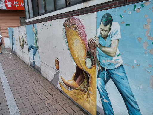 공룡과 싸우는 인간 벽화
