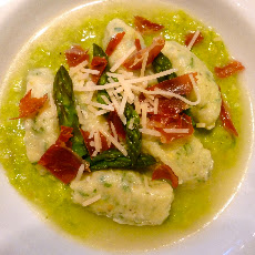 Homemade Goat Milk Ricotta Gnudi on Asparagus Puree in a Parmesan Brodo