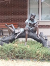 Children Reading on a Tree Statue
