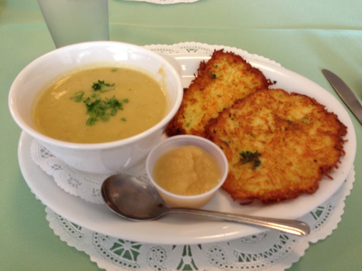 Potato Pancakes with applesauce and sour cream, and a cup of soup.