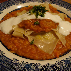 Leek Dumplings with Split Yellow Peas and Carrot Sauce