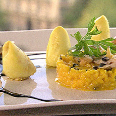 Mediterranean Squid (calamari) filled with Shellfish, Saffron Risotto and Ink Sauce