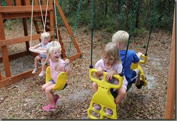 4 kids swinging 06-2011