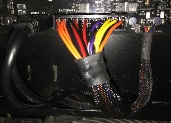 Picture of the internal power cable connected the input power socket of the PSU