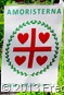 DSC07678.JPG Amoristernas banér logotyp röd grön vit. Beskuren närbild. Med amorism