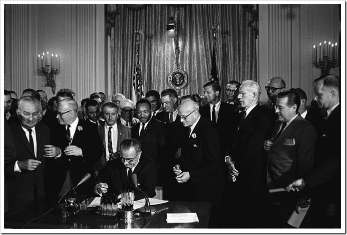 800px-Lyndon_Johnson_signing_Civil_Rights_Act,_July_2,_1964