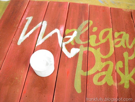 painting in the letters of the sign