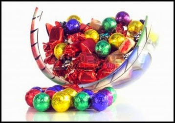 7354958-christmas-sweets-in-a-glass-bowl-with-reflection-on-white