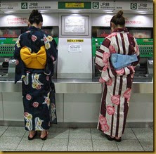 Women-wearing-yukata-buying-train-tickets