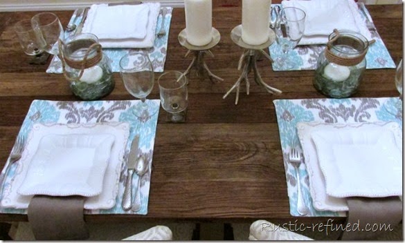 This tablescape was inspired by the temperatures outside. Using cool colors of water and a cold grey sky, I set a modern yet beachy table