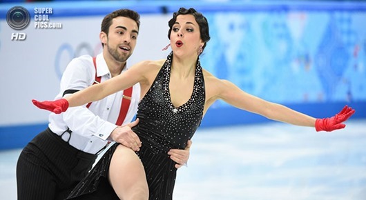 Feb 16, 2014; Sochi, RUSSIA;  Sara Hurtado and Adria Diaz of Spain perform in the ice dance short dance program during the Sochi 2014 Olympic Winter Games at Iceberg Skating Palace.  Mandatory Credit: Robert Deutsch-USA TODAY Sports