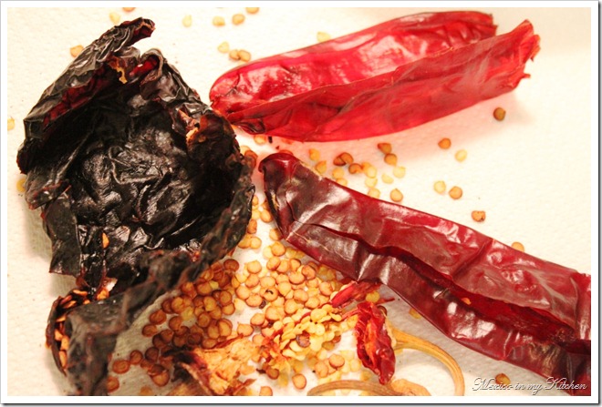 ancho peppers and guajillo peppers to make red sauce for pork tamales