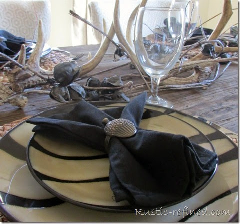 Rustic tablescape using antlers and animal print dishes