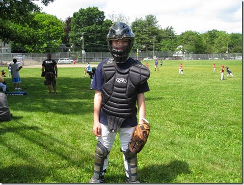 boy baseball catcher's gear