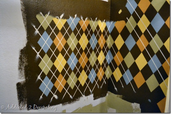 Repurposed closet--coat closet turned utility closet, argyle pattern painted on walls