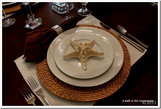 brown and white tablescape with shells