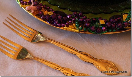 gold flatware for mardi gras table