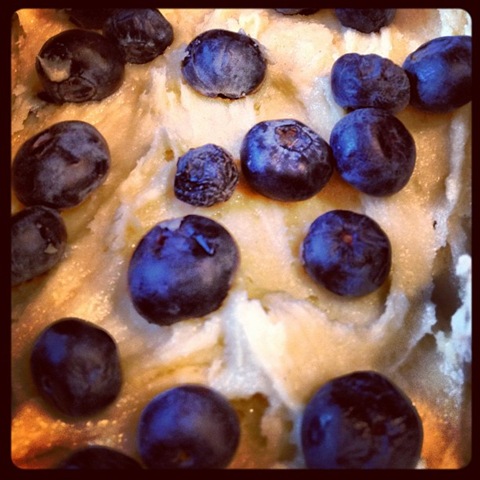 Blueberry loaf cake being layered