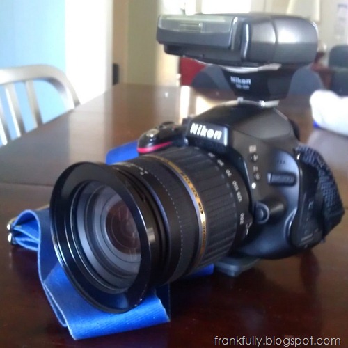 my Nikon D5100 with Tamron 18-200mm lens, 77mm step up ring, and SB400 flash