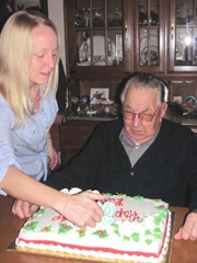 12.10.2011 dads 93rd bday kelly lighting candles on cake with dad