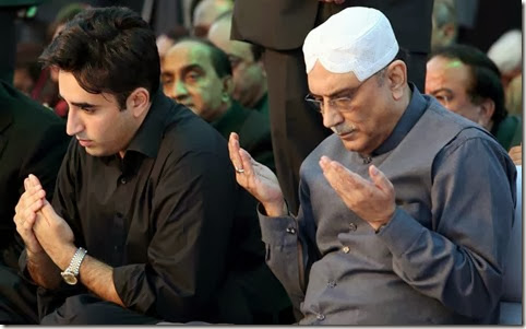 GARHI KHUDA BUX, PAKISTAN, DEC 27: Former President and Co-Chairman Peoples Party (PPP), Asif Ali Zardari and Peoples Party (PPP) Patron-in-Chief Bilawal Bhutto Zardari offer Fateha during public gathering on the occasion of Benazir Bhutto Sixth Death Anniversary, held in Garhi Khuda Bux on Friday, December 27, 2013. From all over the Pakistan devotees of Benazir Bhutto and activities of Peoples Party are attending congregation of Benazir Bhutto death anniversary in the form of convoys. (Jamal Dawoodpoto/PPI Images).