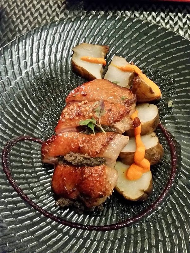 Magret de Pato, duck breast marinated in jerez balsamico, honey and black olives, seared and roasted for 6 minutes at 300, frico and orange berries coulis from Black Fire in Braddon. blackfire.jpg