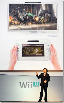 In this photo provided by Nintendo of America, Satoru Iwata, president and ceo of Nintendo, shares details about 'Wii U', a new console launching in 2012 that includes a controller with a 6.2-inch screen, during the company's presentation on the opening day of the 2011 Electronic Entertainment Expo (E3), June 7, 2011 in Los Angeles. The E3 is the video game industry's premier trade show. (Photo by Nintendo of America, Bob Riha, Jr.)  No Sales