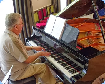 Jim Nicholson playing the Yamaha C3 grand piano
