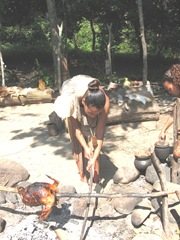 Plimoth Plant indian cook area woman cooking bird2