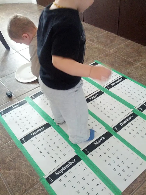 Toddler doing a calendar activity