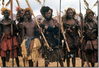 Kuba elders and warriors dressed for the state visit of the Nyim