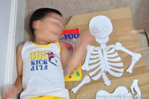 Lying Down Beside Our DIY Human Skeleton Puzzle