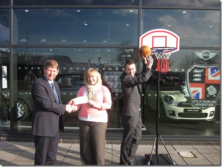 (2)Dealer Principal, Barry Holt, presents Olympic fundraising cheque to Hannah Ward-Salt from The Donna Louise Trust with MINI Brand Manager, Paul Legerton