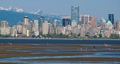 The view of the Vancouver skyline from Kitsilano at low tide