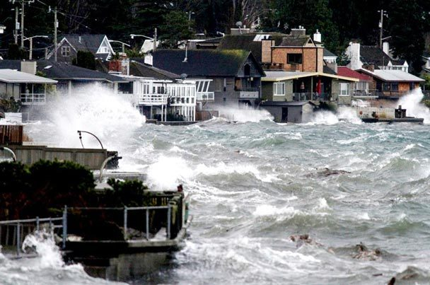 Waves crash on homes along Beach Drive Southwest in Seattle, on Monday, 17 December 2012. Flooding was widespread. Monday's highest tides ever recorded in Seattle, which sent waves spilling onto 100 properties in West Seattle, city climate-change watchers say the area could be in for more of the same — or worse — in years to come. NICK ADAMS / Seattle Times