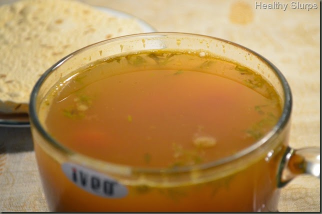 Piping hot Mysore Pepper Rasam with crunchy papads