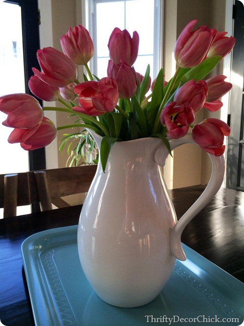 tulips in white pitcher