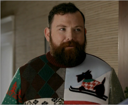 c0 Screen capture from the US Postal Service "ugly sweater" commercial.