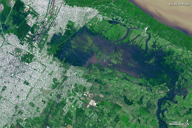 NASA’s Terra satellite captured this image on 4 April 2013 of severe flooding in La Plata, which claimed more than 50 lives, and forced thousands from their homes in the Buenos Aires region. Many of the casualties occurred in La Plata, situated about 60 kilometers (40 miles) southeast of Buenos Aires. Roughly 40 centimeters (16 inches) of rain fell on La Plata in a two-hour period 2–3 April 2013. Photo: NASA / GSFC / METI / ERSDAC / JAROS, and U.S. / Japan ASTER Science Team