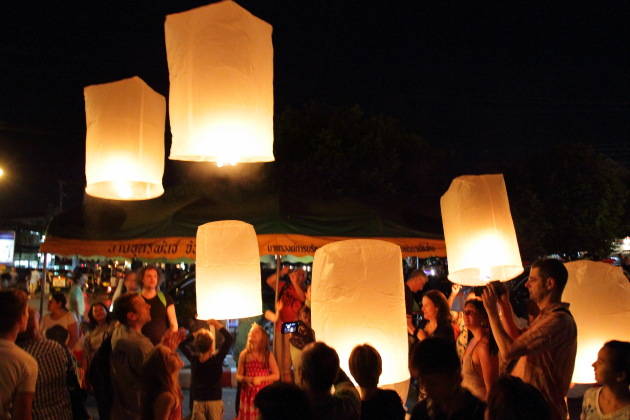 Celebrating New Year by leaving floating lanterns into the sky, chiang mai, thailand