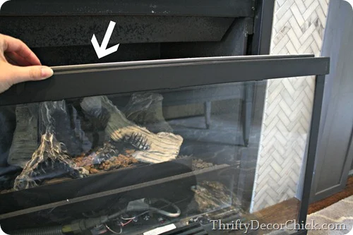 How to remove glass on gas fireplace