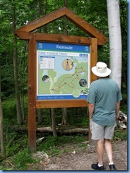 7206 Restoule Provincial Park - walk back to campsite - Bill studying Fire Tower Trail map