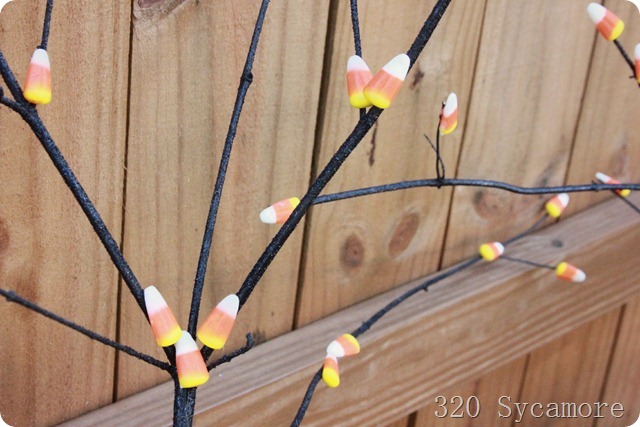 glue candy corn on branches